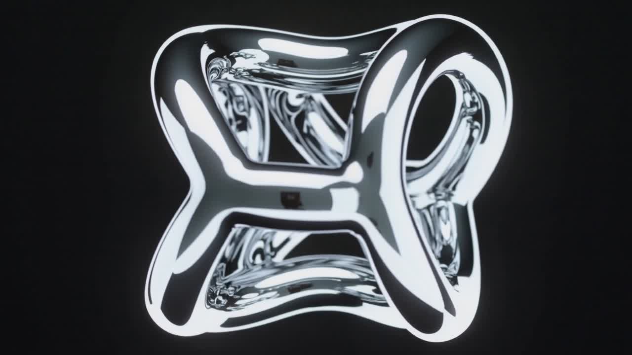 Frames playing, rotating chrome sculpture revealing hollow core and lattice at black studio