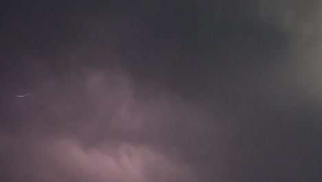 slow motion of multiple lightning bolts during an evening summer storm