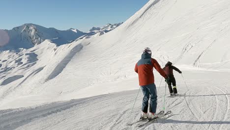 panorama skiing with two male ski althletes in the swiss alps