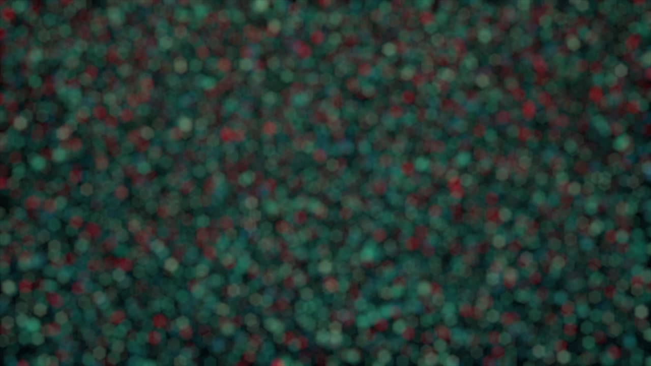 Abstract small blurred bokeh pattern. Animation. Tiny defocused particles of different colors falling down on black background.