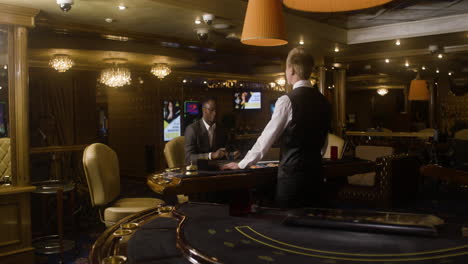 Multiethnic-group-of-people-joining-the-poker-table-in-the-casino.