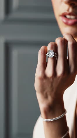 close-up of hands adorned with a sparkling diamond ring and bracelets