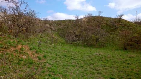 Green-Meadow-And-Hills-In-The-Countryside---Drone-Shot