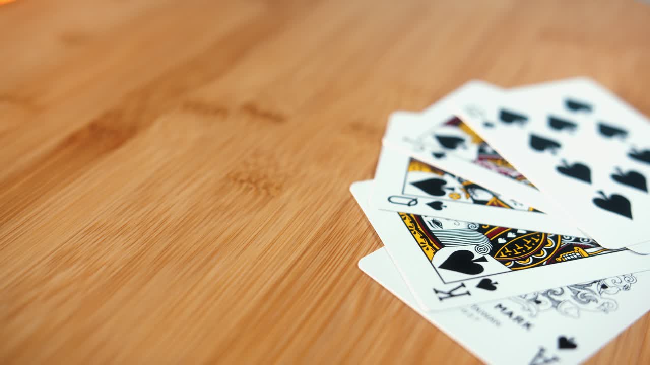 Close Interior Static Shot of Royal Flush of Cards on Spinner in the Day