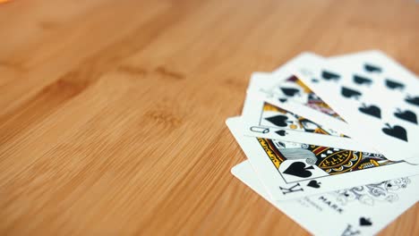 Close-Interior-Static-Shot-of-Royal-Flush-of-Cards-on-Spinner-in-the-Day