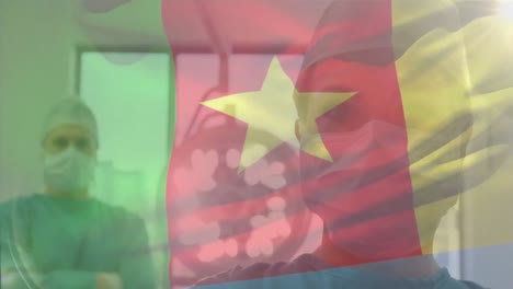 animation of flag of cameroon waving over surgeons in operating theatre