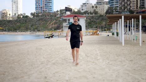 deserted beach on summer’s morning, adult male getting some exercise