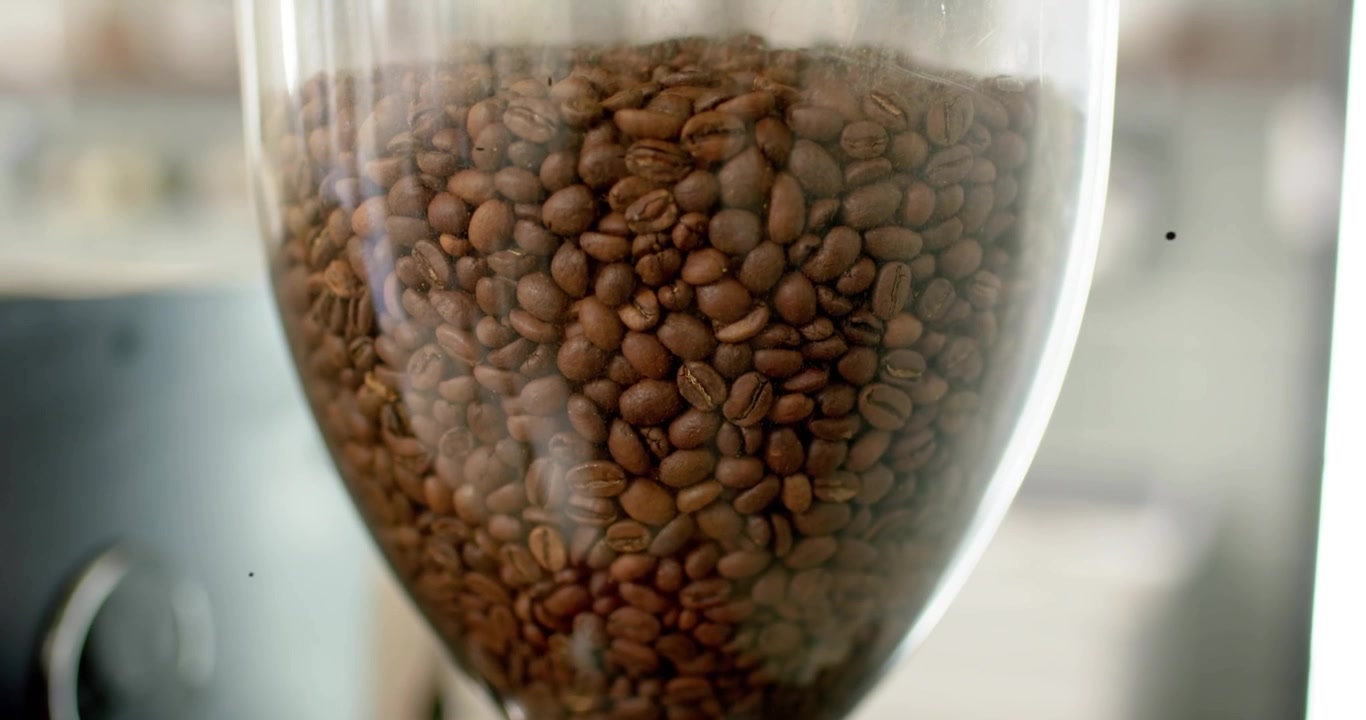 sparkle appearing initiating scan, glass hopper full beans being scanned by teal reticle for test