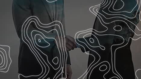 animation of white map lines over businessman handshake