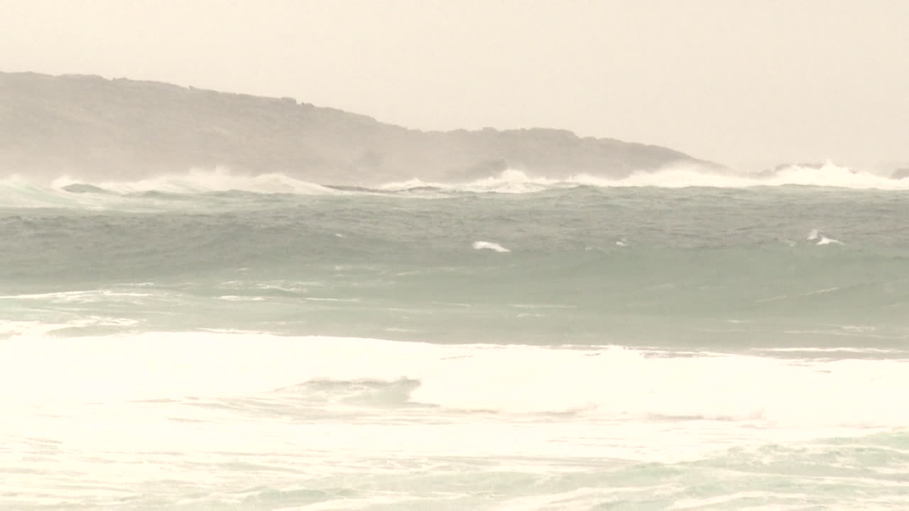 Stormy Ocean Waves Crashing on Rocky Shore