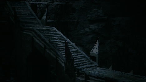 mysterious stone stairs lead into darkness at a secluded location