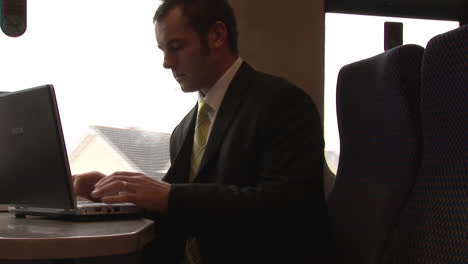 businessman working on a train