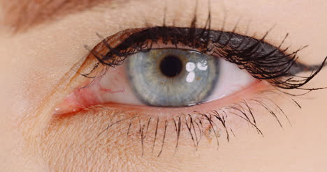 macro shot of blue eye opening human iris womans eye 2