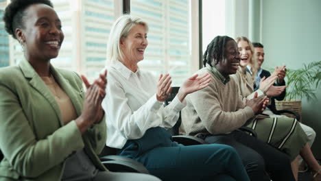 group of business professionals clapping