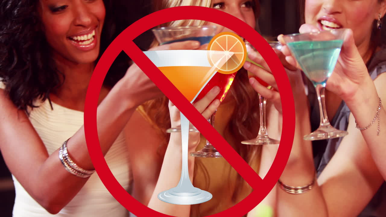 Animation of drink with prohibition sign over diverse female friends holding drinks and making toast