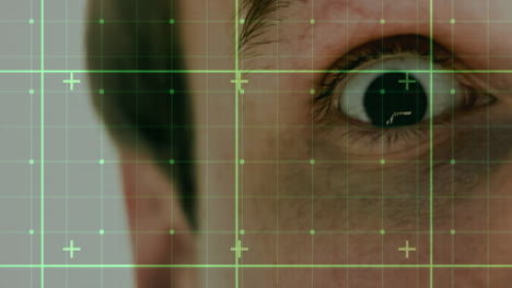 animation of data processing over face of caucasian man with wide open eye