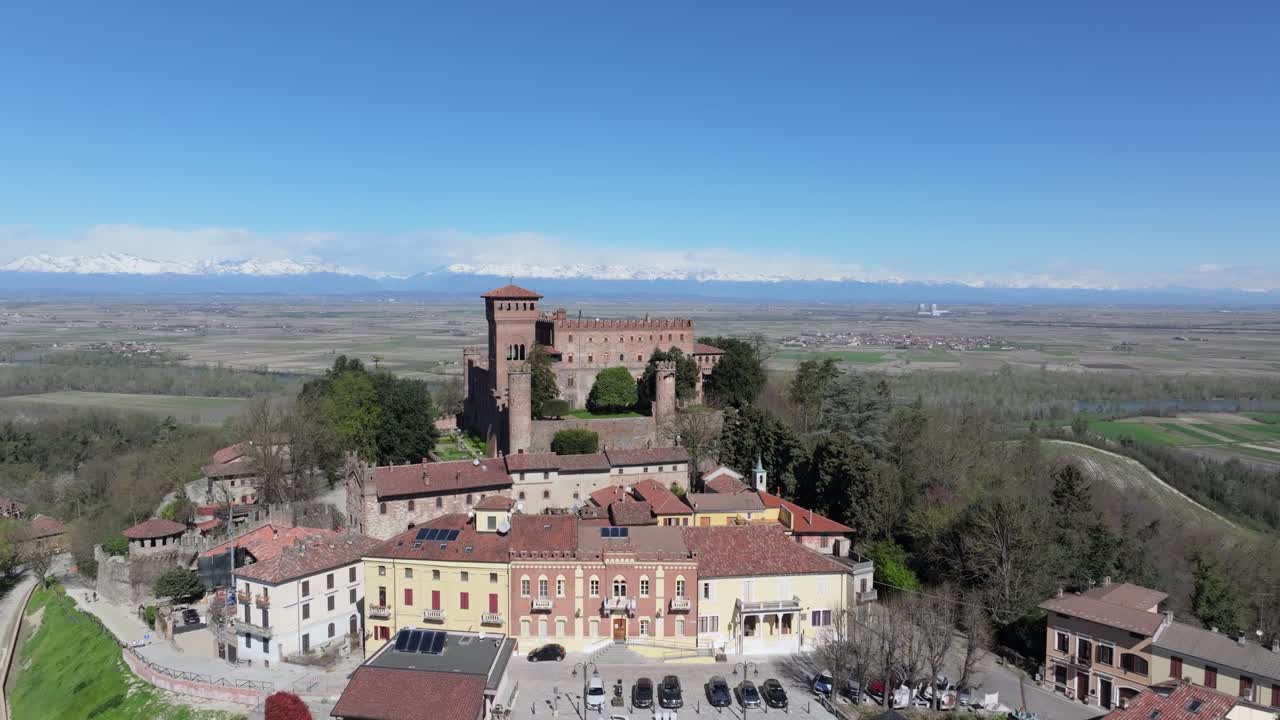 aerial gently moving upward an back away from the rustic small town of Gabiano, Italy.  Hilltop views of the Swiss border