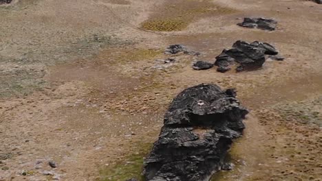 rocks on barren mountain landscape in central otago, new zealand