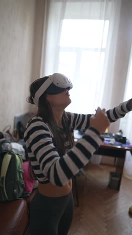 girl playing vr game at home