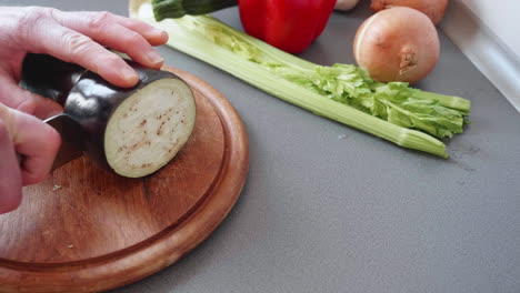 Slow-motion-of-slicing-an-aubergine-into-small-wheels