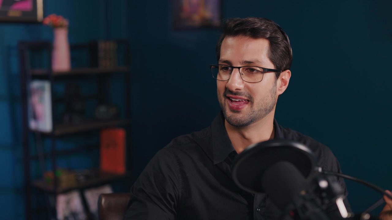 Professional Man Speaking into Microphone in Studio Setting