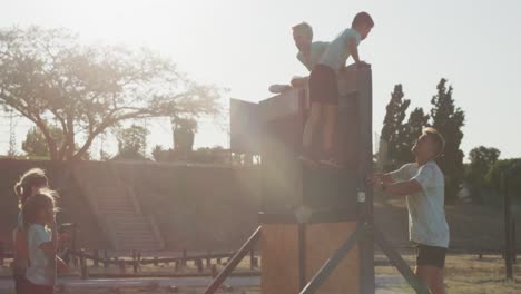 group of caucasian children training at boot camp