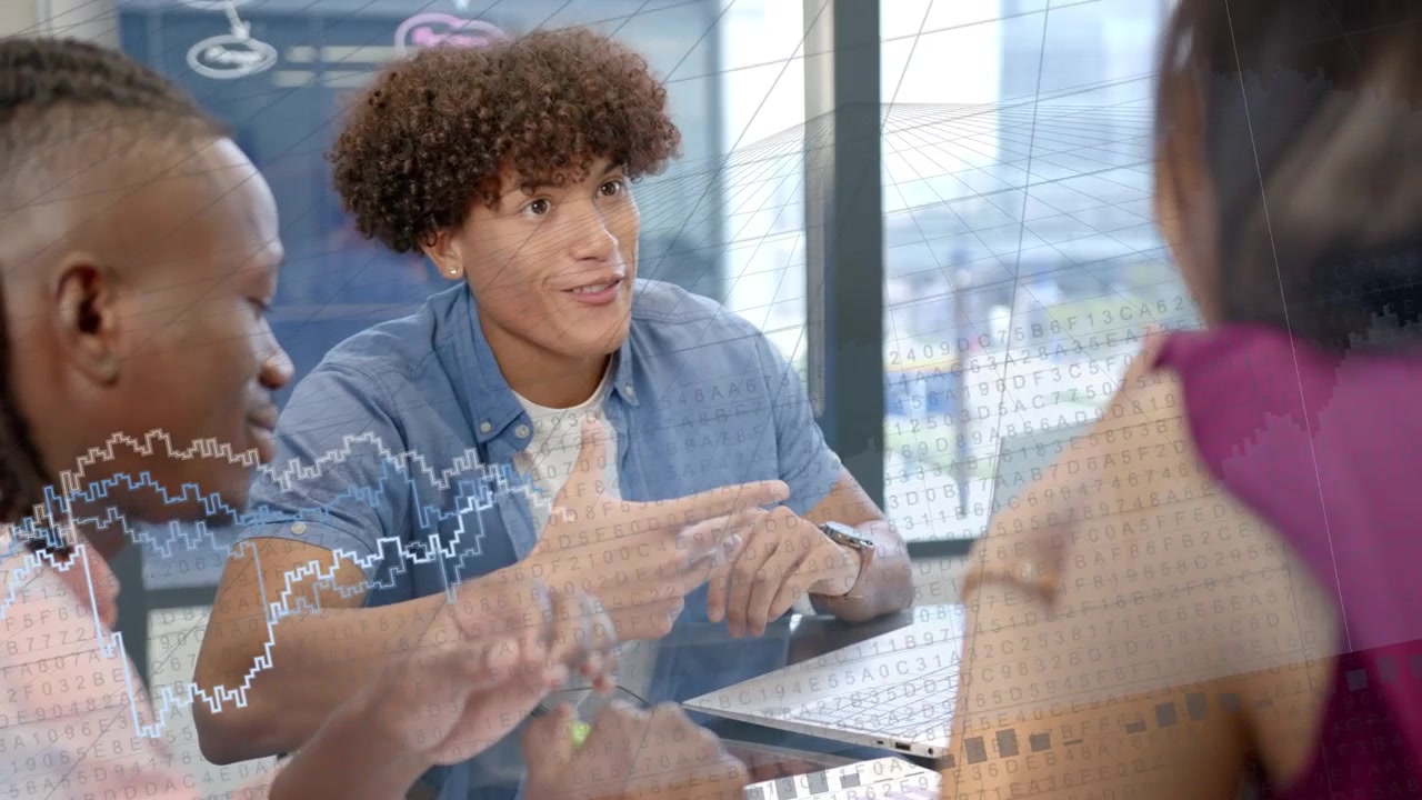 Lead speaker gesturing and showing animated charts on laptop in business meeting for data review