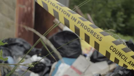 illegal fly tipping waste investigation tape medium shot