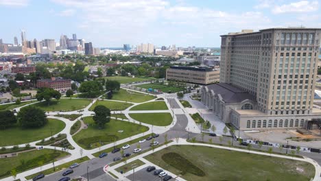 detroit skyline and michigan central station building in corktown, aerial drone view