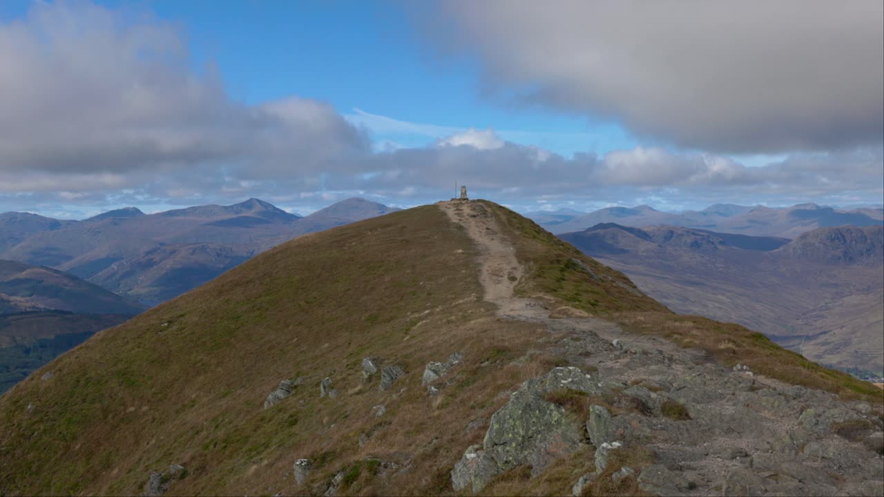Static shot of the trig point on the Munro summit of Ben Vorlich in summer