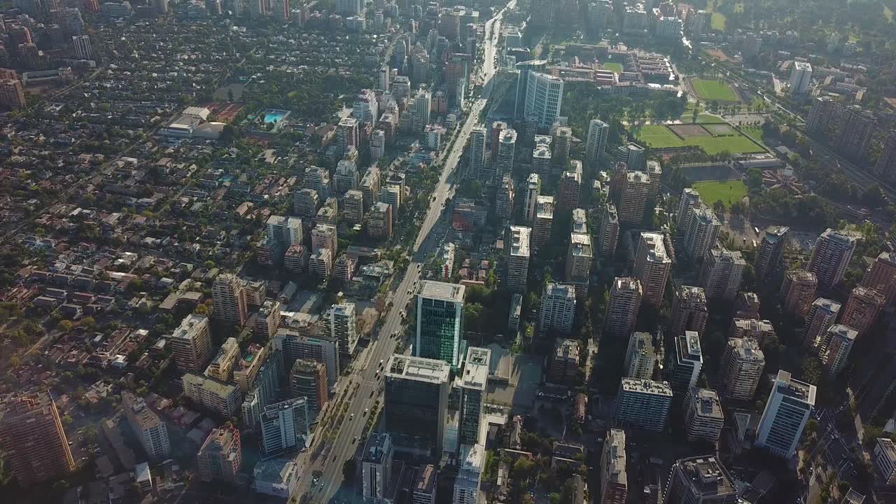 Santiago De Chile, Cinematic Aerial View of Buildings and Street Traffic Under Evening Sunlight. Birdseye