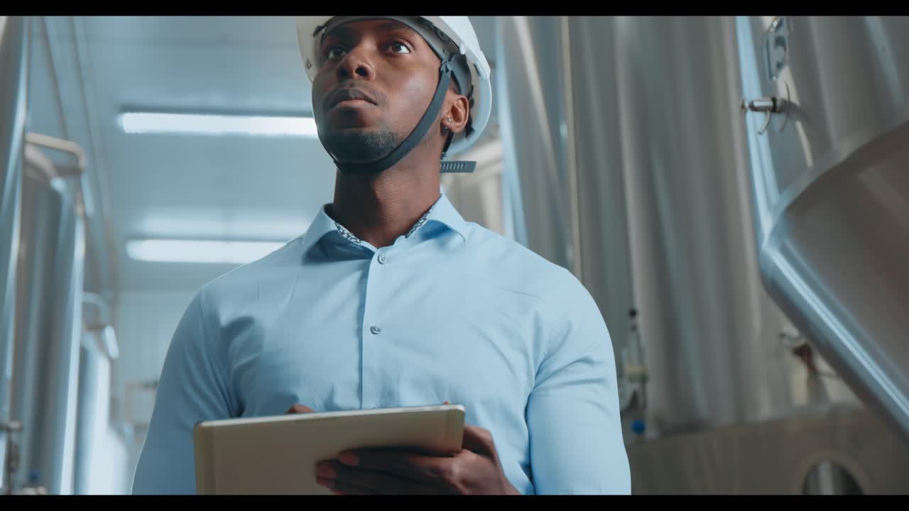 Engineer Inspecting Industrial Equipment