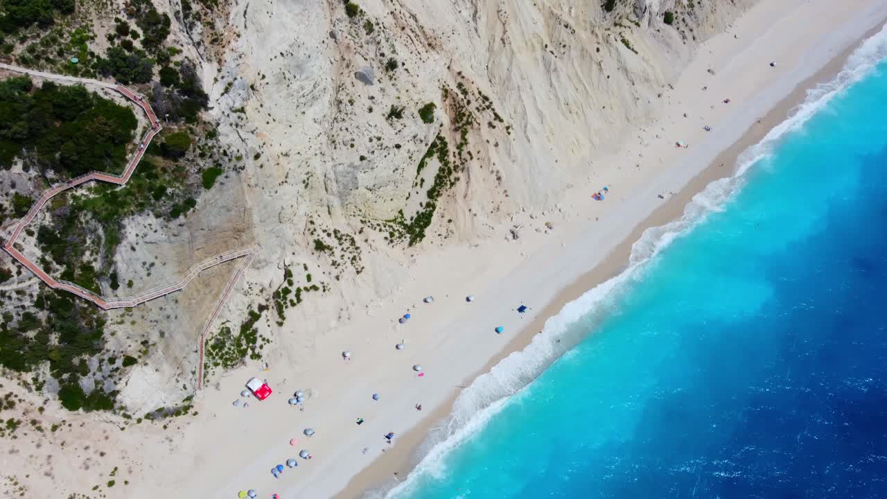 Aerial of egremni beach road on Ionian island of Lefkada with crystal clear water