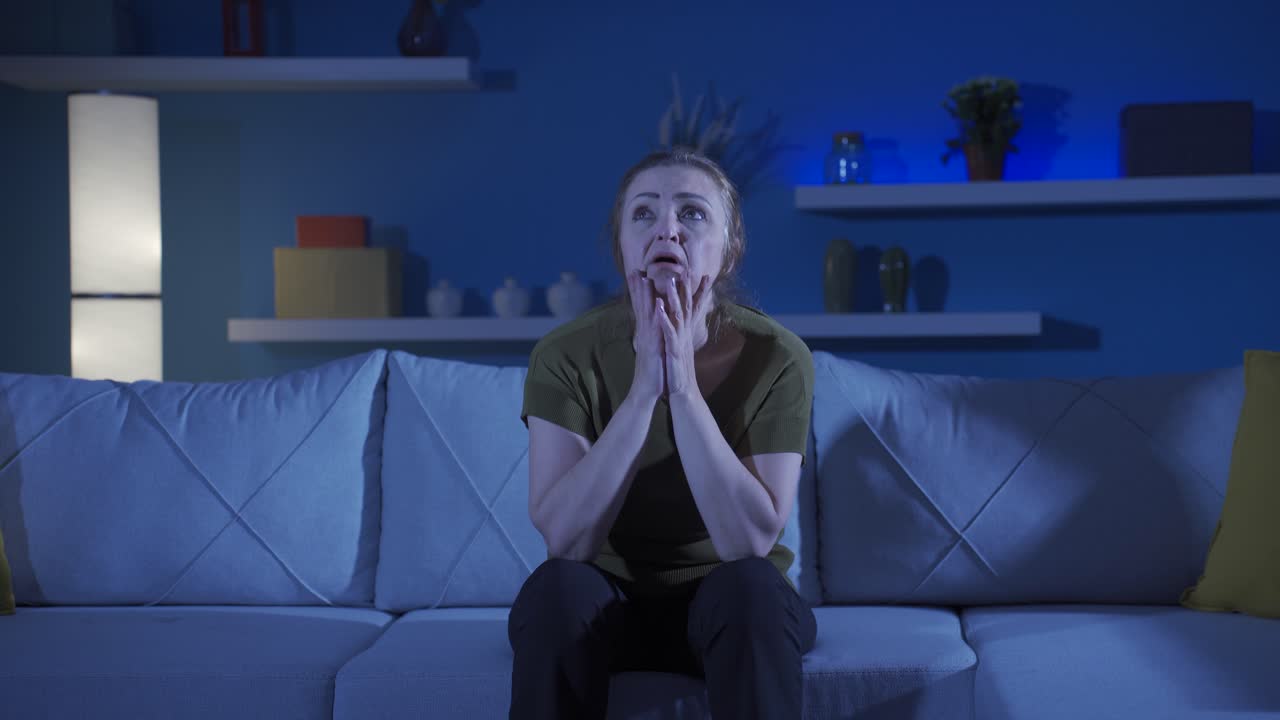 Desperate woman with her hands on her head. Depressed.