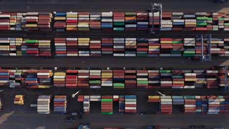 aerial vertical shot of colorful intermodal shipping containers in an industrial port