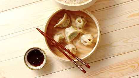 traditional chinese dumplings served in the wooden bamboo steamer