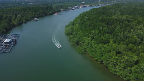 aerial drone view of boat driving on the bagan lalang river in the morning