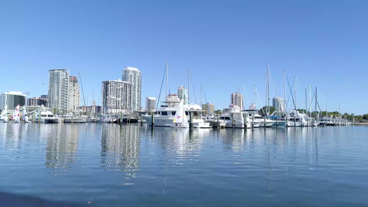4K Video of Small Sailing Skiffs Leaving Marina