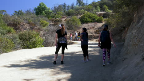 Groups-of-people-walking-up-a-mountain-trail-at-Los-Angeles-California