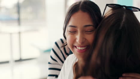 Friends,-women-and-hug-in-restaurant-for-reunion