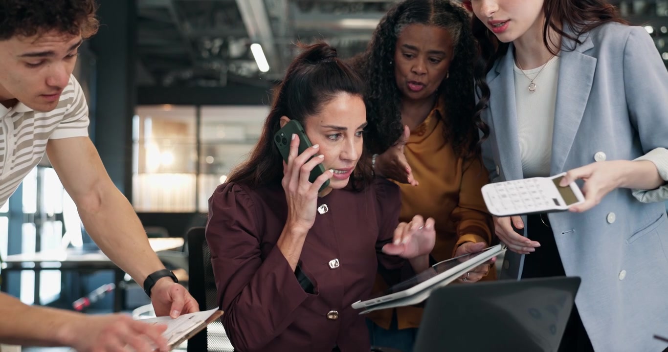 Diverse Business Team Collaborating on Project in Modern Office
