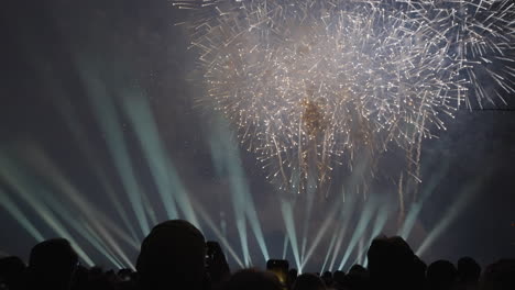 group capturing the exploding fireworks on cell phones