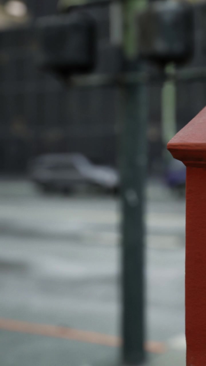 A red box stands next to a parking lot