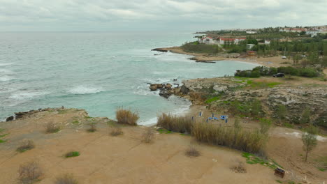 Cloudy-day-with-stormy-waves-at-beach-of-Paralimni,-Cyprus