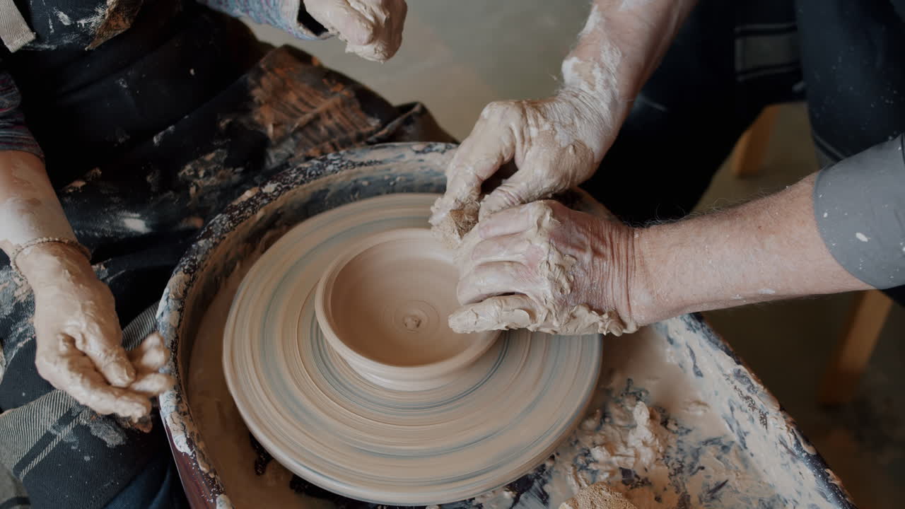 Pottery Class: Hands Shaping Clay on Potter's Wheel
