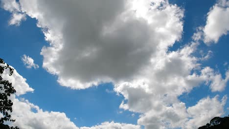 timelapse of imposing clouds revealing bright sun flare