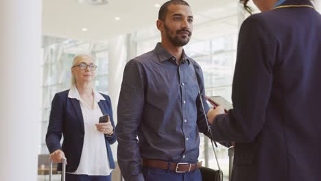 happy mixed race man showing electronic flight ticket