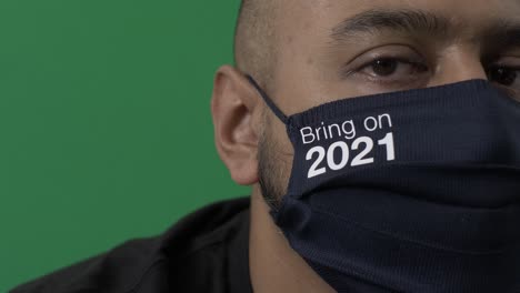 adult male wearing bring it on 2021 face mask looking at camera