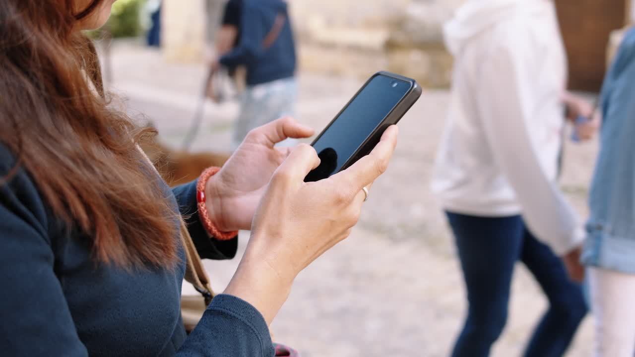 Modern connection in historic Dordogne, focus on screen, tan tones