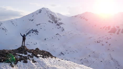 hiker on mountain summit